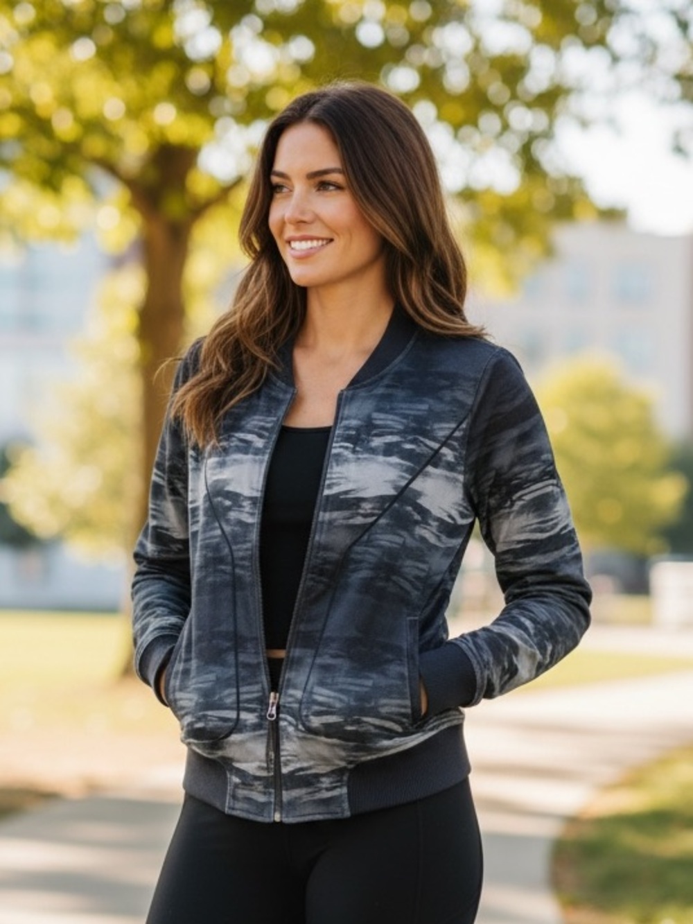 Athleta Bombtastic bomber jacket in a dark grey and black shadow camo print